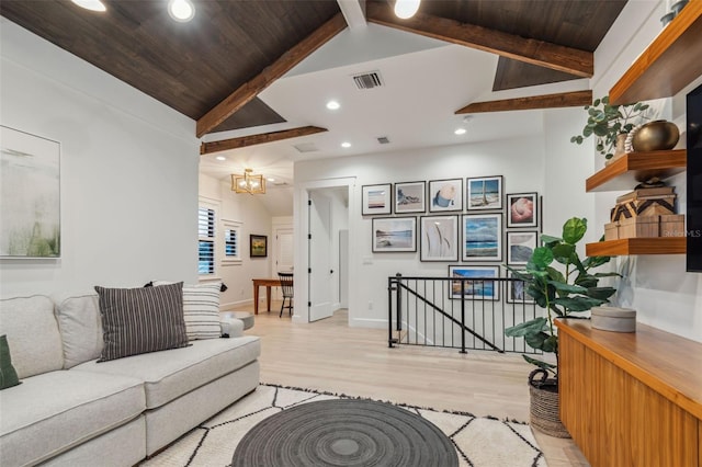 living room with lofted ceiling with beams, light hardwood / wood-style floors, wood ceiling, and an inviting chandelier