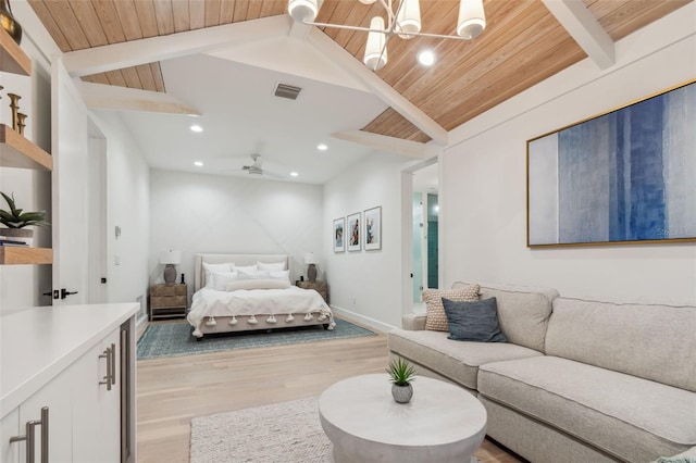 bedroom with vaulted ceiling with beams, an inviting chandelier, wood ceiling, and light wood-type flooring