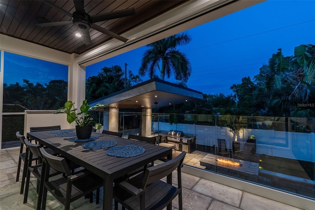 patio terrace at dusk with ceiling fan