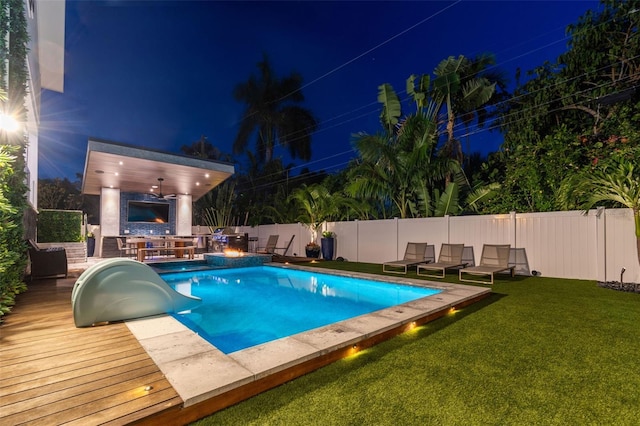 pool at twilight with a lawn