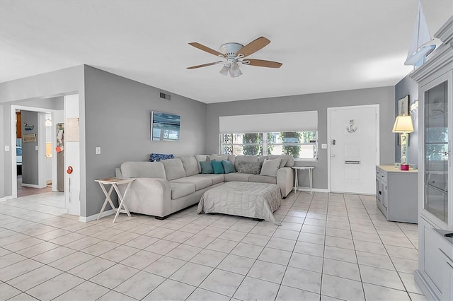 living room featuring ceiling fan and light tile patterned floors