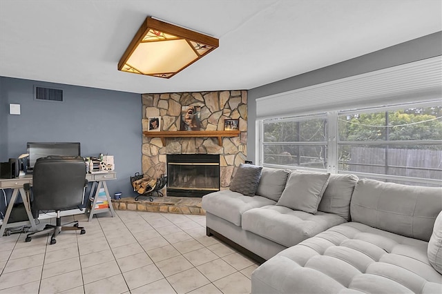 living room featuring light tile patterned floors and a fireplace