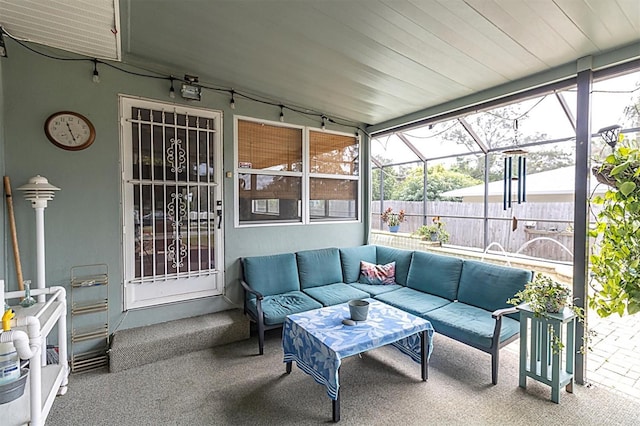 sunroom / solarium featuring lofted ceiling