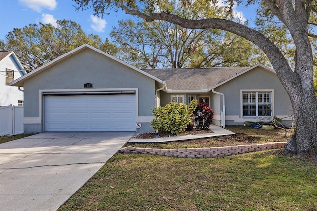 ranch-style home featuring a front lawn and a garage