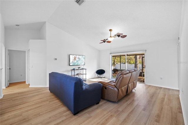 living room with vaulted ceiling, ceiling fan, and light hardwood / wood-style floors