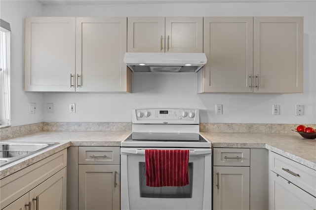 kitchen with white electric range oven and sink