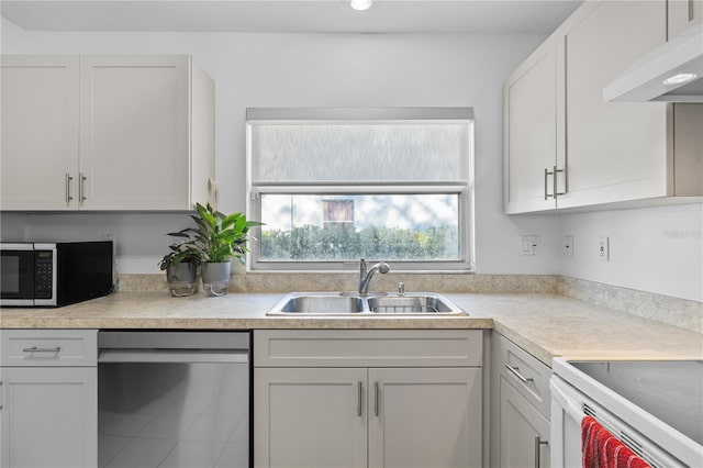 kitchen featuring appliances with stainless steel finishes, sink, and white cabinets