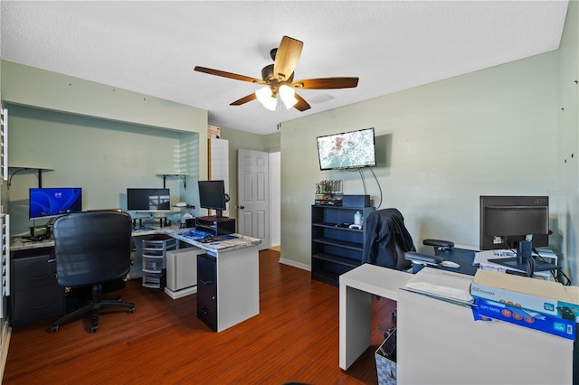 office featuring dark hardwood / wood-style flooring, a textured ceiling, and ceiling fan