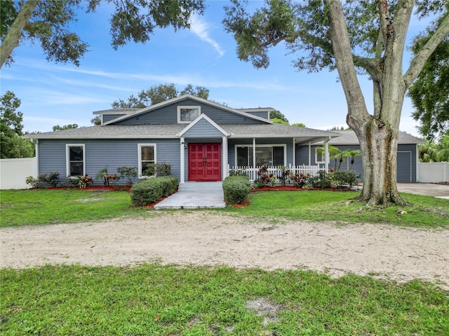 view of front of property with a front yard and a porch