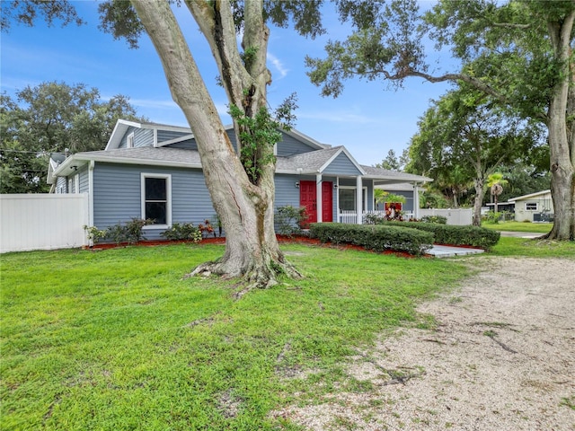 view of front of home featuring a porch and a front lawn