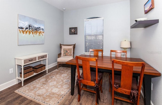 dining area with hardwood / wood-style floors