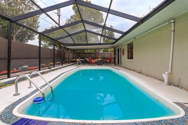 view of pool featuring a lanai