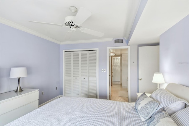 bedroom featuring a closet, ceiling fan, and ornamental molding