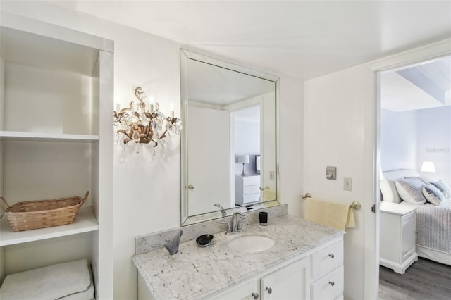 bathroom featuring hardwood / wood-style floors and vanity