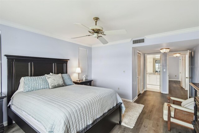 bedroom featuring ceiling fan, ornamental molding, and dark hardwood / wood-style flooring