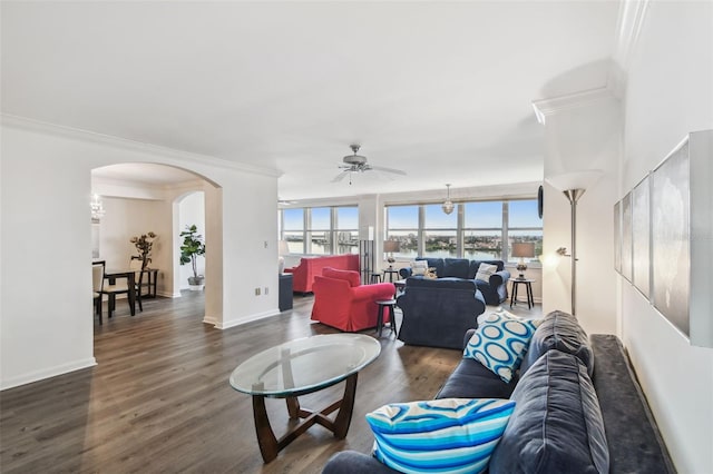 living room featuring ceiling fan, crown molding, and dark hardwood / wood-style flooring