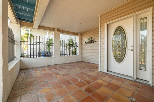 property entrance featuring covered porch