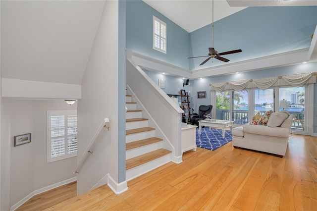 living room with ceiling fan, hardwood / wood-style floors, and plenty of natural light