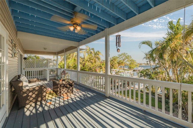 wooden deck with an outdoor living space