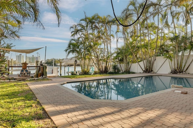 view of pool with a water view