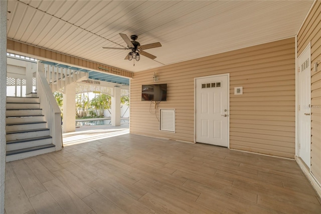 238 71st Ave, St Pete Beach, FL 33706 - view of patio featuring stairway and a ceiling fan