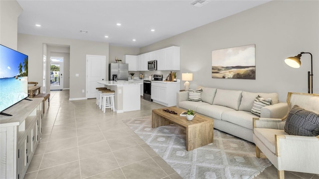 living room featuring light tile patterned flooring