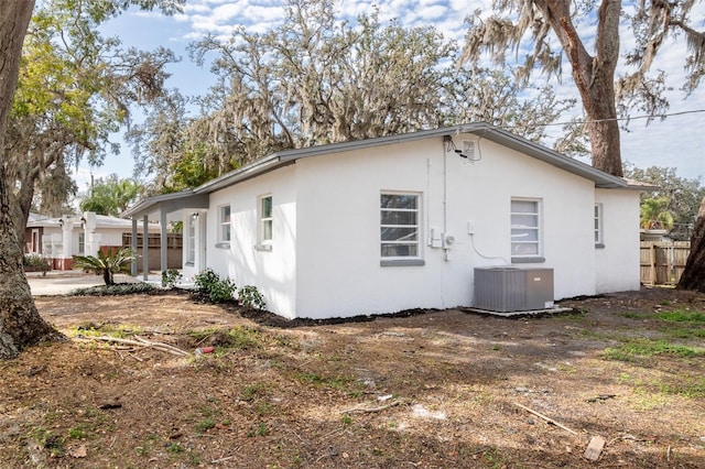 view of home's exterior with central AC unit