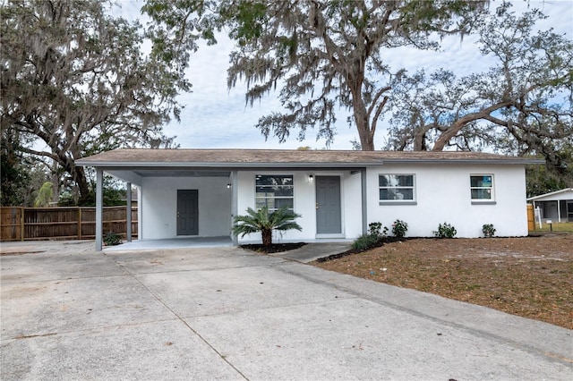 ranch-style home with a carport