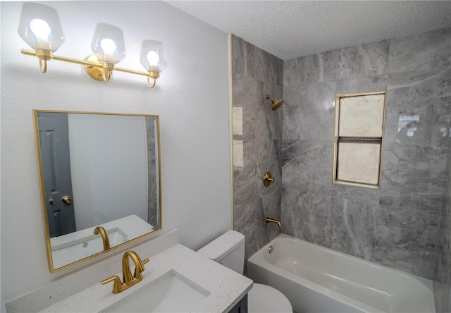 full bathroom with tiled shower / bath combo, toilet, a textured ceiling, and vanity