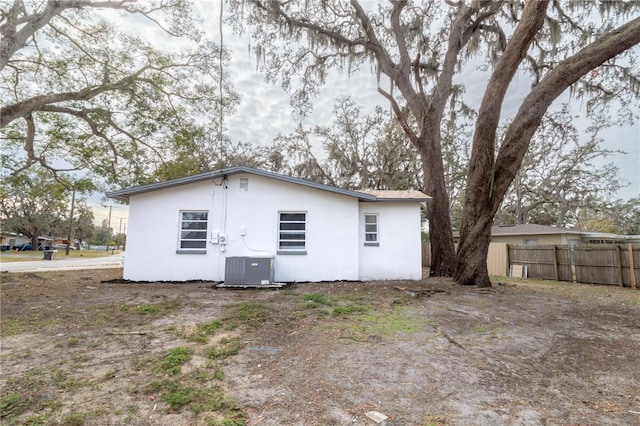 back of property featuring central air condition unit