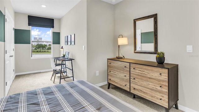 bedroom featuring light colored carpet