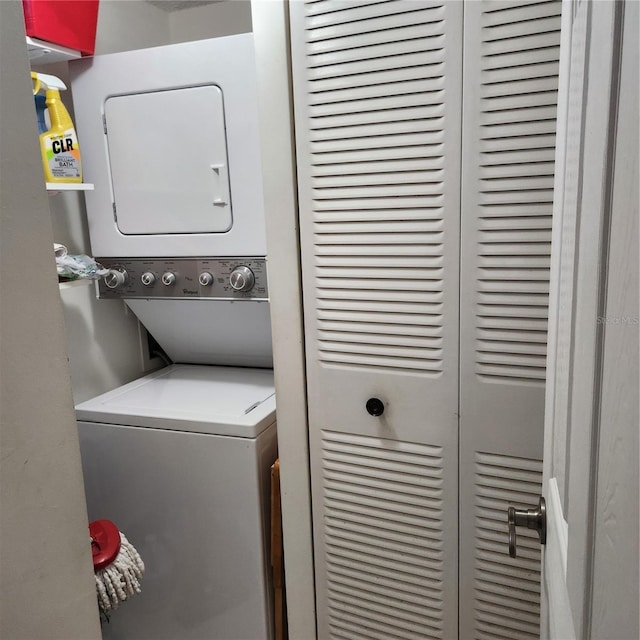 laundry room with stacked washer and clothes dryer