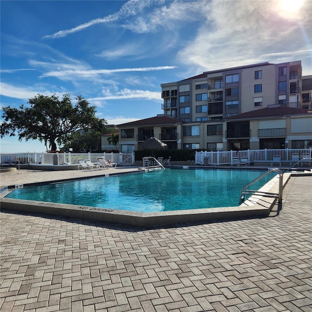 view of swimming pool featuring a patio area