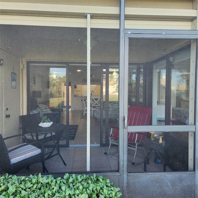 view of patio with a sunroom