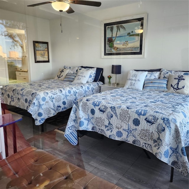 tiled bedroom featuring ceiling fan