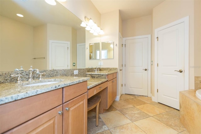 bathroom featuring a bathing tub and vanity