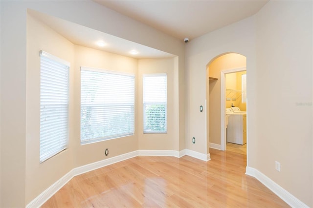 spare room featuring light hardwood / wood-style flooring