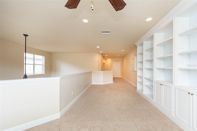 hallway with light carpet