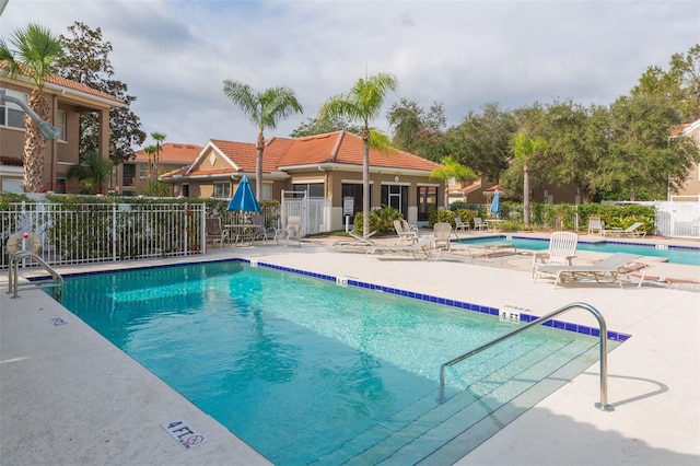 view of swimming pool featuring a patio area