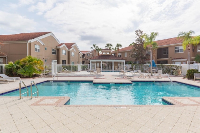 view of swimming pool with a patio