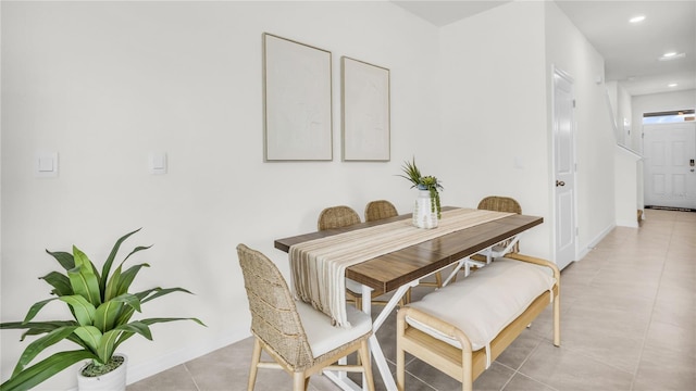 dining space featuring light tile patterned flooring