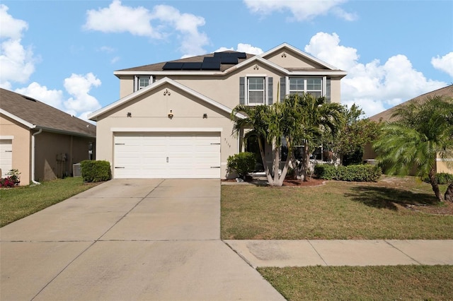 view of front of house with solar panels, a garage, central air condition unit, and a front yard