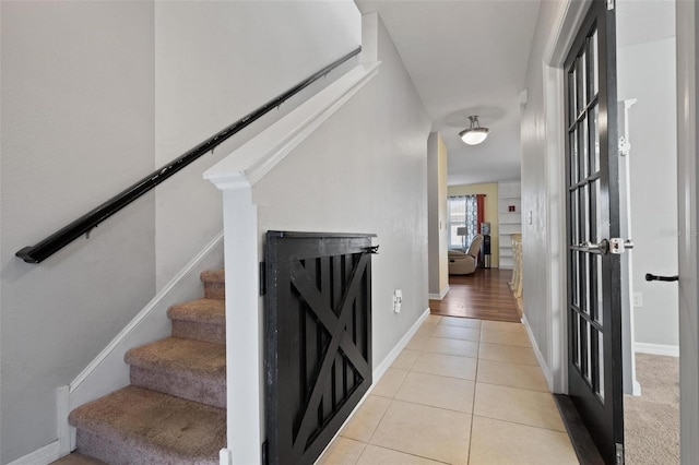 stairway featuring tile patterned floors