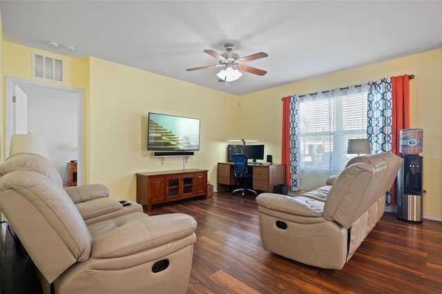 living room with ceiling fan and dark wood-type flooring