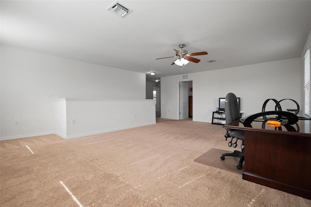 carpeted home office with ceiling fan