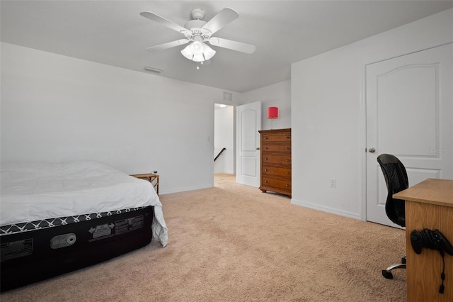 bedroom featuring light colored carpet and ceiling fan