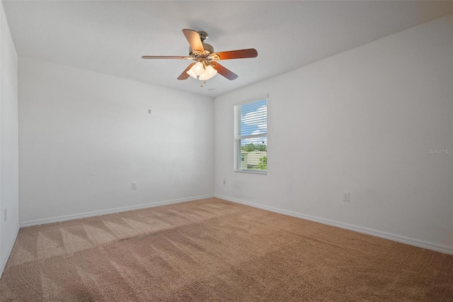 unfurnished room featuring ceiling fan and light colored carpet