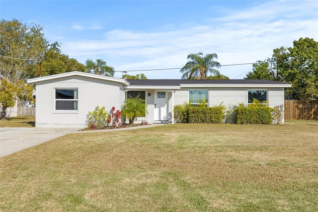 single story home with a front lawn