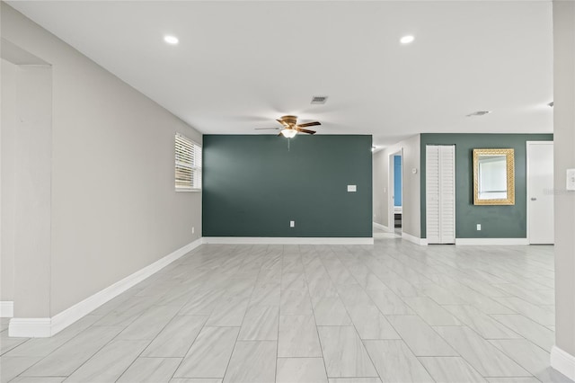 unfurnished living room featuring ceiling fan