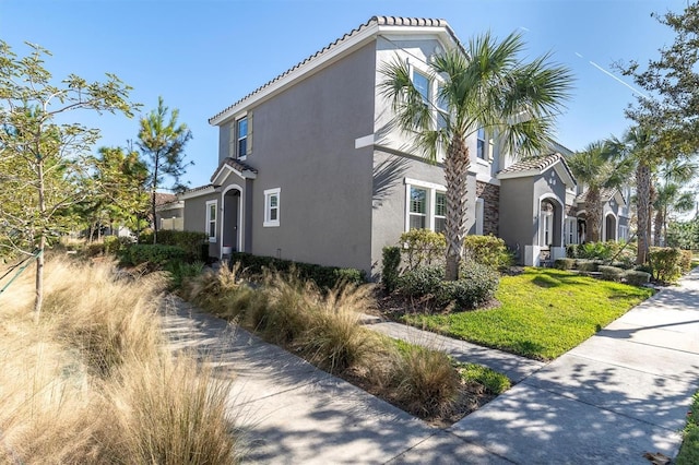 view of property exterior featuring a lawn